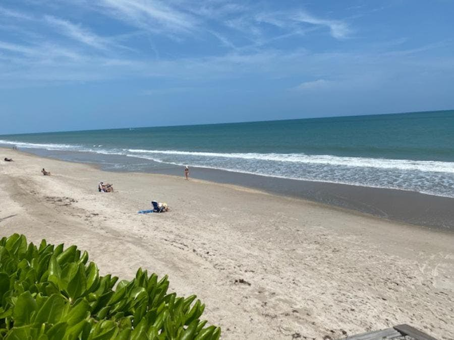 View north of private Summerplace beach with only 4 people on huge beach